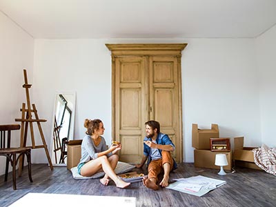 Man and woman unpacking after shipping art 