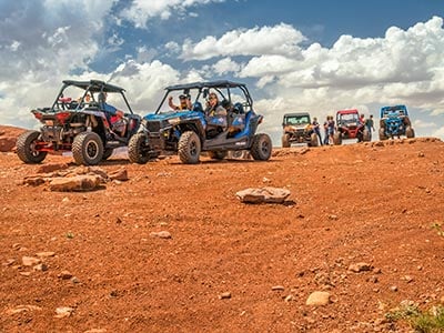 People on ATVs in the desert
