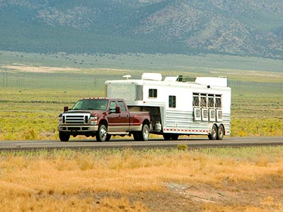 Truck hauling livestock trailer